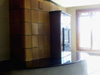 Another view highlighting the textures imparted by kachel, granite, and stucco.  The beauty of choosing kacheln for a masonry heater is that you can choose virtually any color you might like ranging from bright and vivid to subtle and gentle.  And the performance of such a heater is superior to most other typical masonry materials.