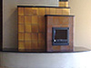 A true American kachelofen.  This unique masonry heater features handmade ceramic kacheln.  The kachelofen is assembled in the traditional Austrian fashion but utilizes the latest engineered efficiency design.  This particular heater is about 86% efficient and is designed to heat the 1200 square foot space in which it sits.